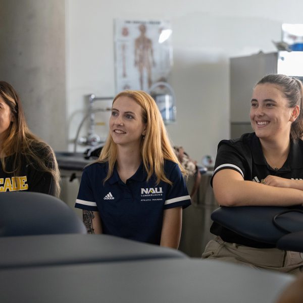 Athletic trainers sitting by